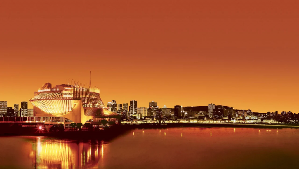 魁北克蒙特利尔夜景与赌场大楼全景图，象征Loto-Québec发展。