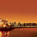 魁北克蒙特利尔夜景与赌场大楼全景图，象征Loto-Québec发展。