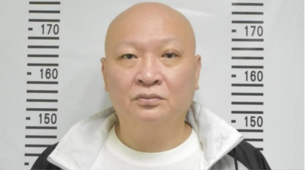 涉赌通缉犯林秉文证件照显示警方通缉背景