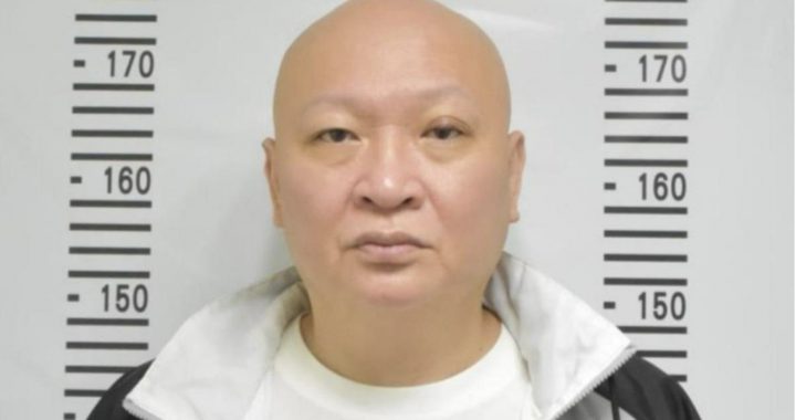 涉赌通缉犯林秉文证件照显示警方通缉背景