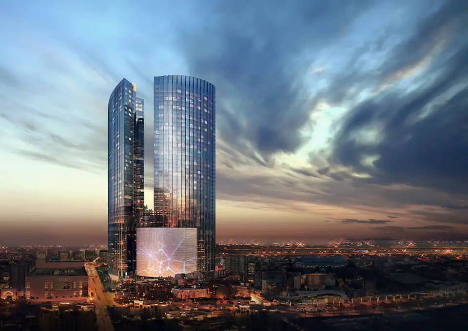 济州梦想塔双塔建筑夜景，乐天旅游发展公司计划推出滚动佣金计划提升赌场收入